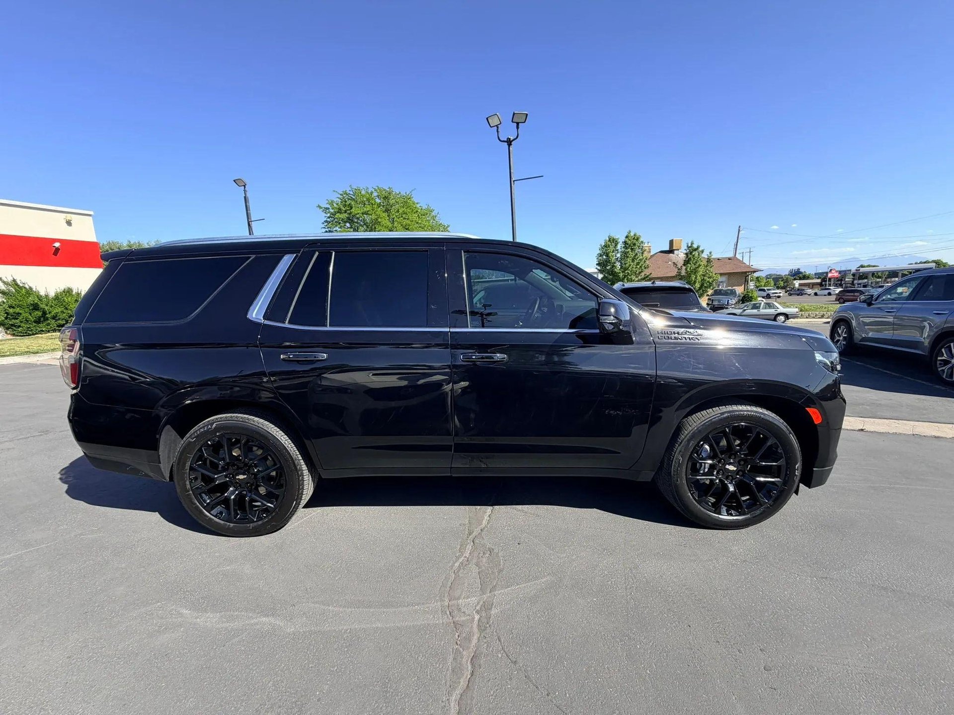 Black SUV after passenger-side collision repair
